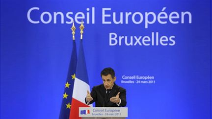 Le président Nicolas Sarkozy, au sommet européen de Bruxelles, le 25 mars 2011, justifie l'intervention en Libye. (AFP/LIONEL BONAVENTURE)