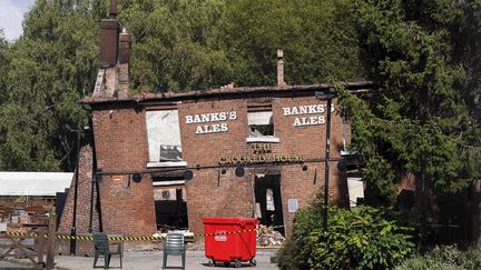 Les restes calcinés du pub The Crooked House près de Dudley, en Angleterre, le lundi 7 août 2023. (JACOB KING/AP/SIPA / SIPA)