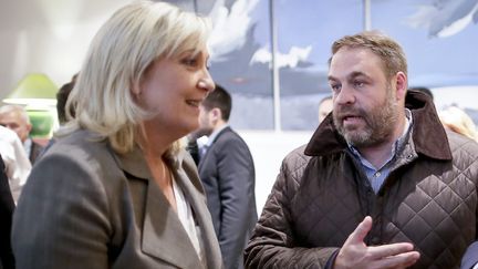 Marine Le Pen et Axel Loustau, conseiller régional FN d'Ile-de-France, le 23 juin 2015 à Paris. (THOMAS PADILLA / MAXPPP)