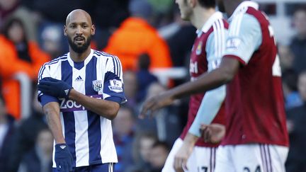 Nicolas Anelka c&eacute;l&egrave;bre son but en faisant une "quenelle", samedi 28 d&eacute;cembre 2013, &agrave; Upton Park, pr&egrave;s de Londres (Grande-Bretagne).&nbsp; (IAN KINGTON / AFP)