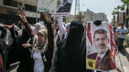 Des manifestants pro-Morsi, le 8 ao&ucirc;t 2014 au Caire. (AHMED ISMAIL / ANADOLU AGENCY / AFP)