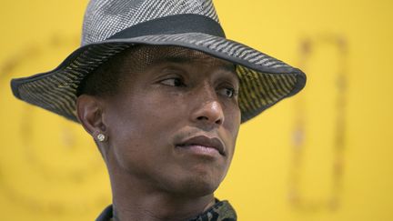 Pharrell Williams le 26 mai 2014 à la galerie Perrotin (Paris) lors de la présentation de l'exposition "GIRL" dont il est le commissaire.
 (Fred Dufour / AFP)