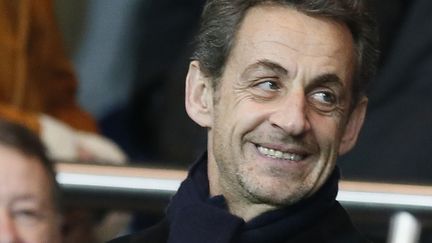 Nicolas Sarkozy dans les gradins du Parc des Princes lors de la rencontre PSG - Lille, &agrave; Paris, le 27 janvier 2013. (KENZO TRIBOUILLARD / AFP)