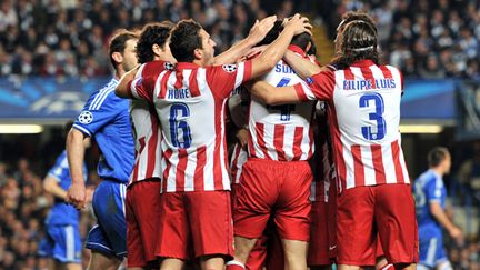 La joie de l'Atlético Madrid sur la pelouse de Chelsea (GLYN KIRK / AFP)