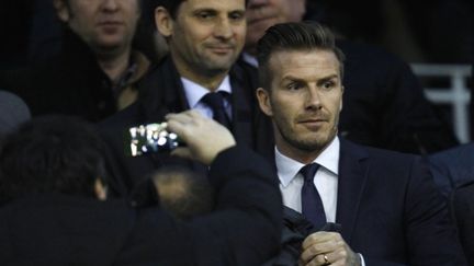 David Beckham photographi&eacute; dans les tribunes du stade de Valence (Espagne) pendant le match Valence-PSG en Ligue des champions, le 12 f&eacute;vrier 2013. (JOSE JORDAN / AFP)