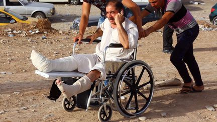 Des r&eacute;fugi&eacute;s irakiens fuient Mossoul, aux mains des insurg&eacute;s d'EIIL, dans le camp de Khazir, le 11 juin 2014.&nbsp; ( STR / AP / SIPA )