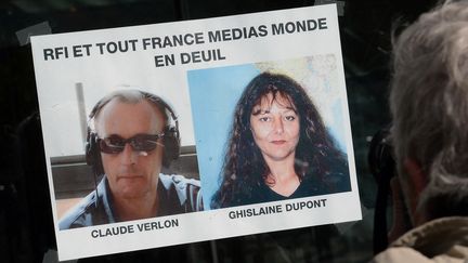 A poster of support for journalists Claude Verlon and Ghislaine Dupont after their assassination on November 2, 2013. (PIERRE ANDRIEU / AFP)