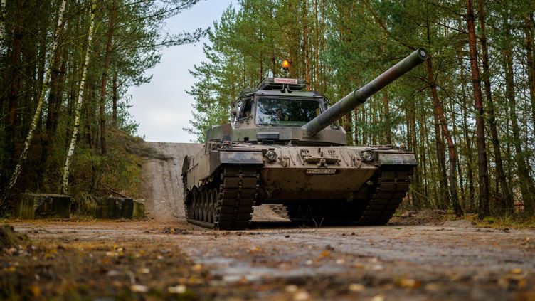 A Slovak soldier drives a Leopard 2 tank in Münster, Germany on November 24, 2022.  (Philip Sculls/dpa/AFP)