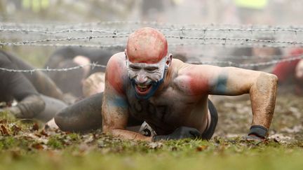 ... suivi d'une course d'obstacles fa&ccedil;on parcours du (super) combattant durant laquelle s'encha&icirc;nent les &eacute;preuves aux noms po&eacute;tiques tels &laquo; le tunnel de la torture vietcong &raquo; ou &laquo; l'anaconda &raquo;. (JON SUPER / AP / SIPA)