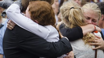 A la sortie d'une &eacute;glise &agrave; Oslo, deux jours apr&egrave;s le massacre de Breivik, le 24 juillet 2012. (JAN JOHANNESSEN / AFP)