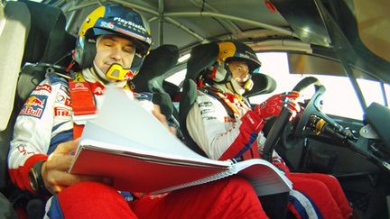 Loeb et Elena dans leur élément à bord de la Citroën C4 WRC