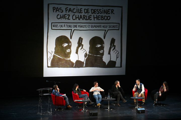 La&nbsp;rédaction de Charlie Hebdo, à Strasbourg le 2 novembre, lors d'une rencontre avec le public, inédite depuis l'attentat de 2015, pour réaffirmer le rôle de la presse satirique et de la caricature. (PATRICK HERTZOG / AFP)