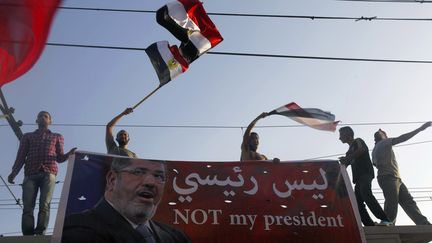 Des opposants au pr&eacute;sident &eacute;gyptien Mohamed Morsi, au Caire (Egypte), le 30 juin 2013. (AMR DALSH / REUTERS )