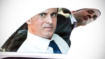 Le ministre de l'Int&eacute;rieur, Manuel Valls, regarde par la vitre de sa voiture sur laquelle se refl&egrave;te l'un de ses gardes du corps lors d'un d&eacute;placement &agrave; Cayenne (Guyane), le 7 mars 2013. (JODY AMIET / AFP)