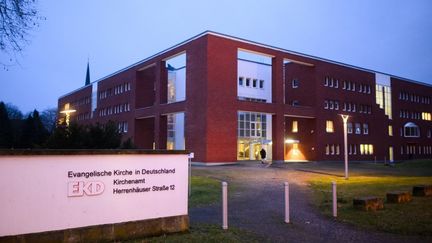 A sign hangs in front of the parish office of the Evangelical Church of Germany (EKD) in Hanover, Germany, on January 23, 2024, two days before the publication of scientific studies on sexualized violence and abuse in the Protestant Church.  (JULIAN STRATENSCHULTE / DPA / AFP)