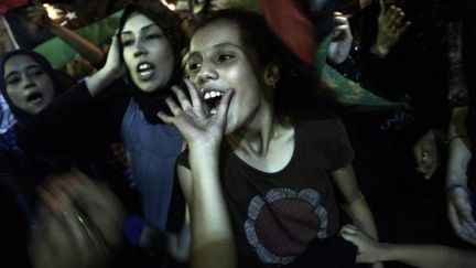 Des Libyennes crient leur joie lors d'un rassemblement sur la place de la Liberté le 22 août dernier. (GIANLUIGI GUERCIA / AFP)