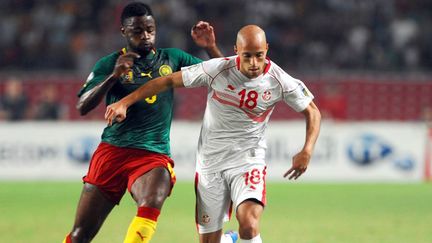 Yassine Mikeri (Tunisie) au duel avec Bilong Song (Cameroun). 